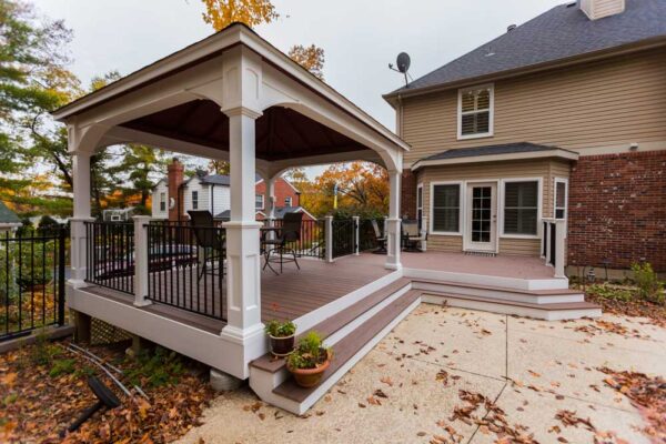 Covered Deck with Deckorators Vault Decking Mesquite White Vinyl Pavilion Wraparound Stairs