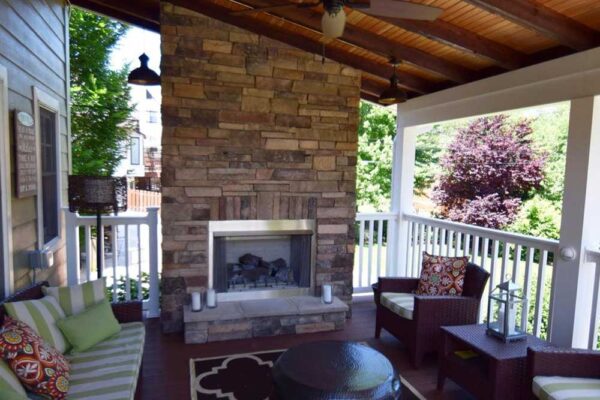 Outdoor Sun Room with Covered Deck and Fireplace
