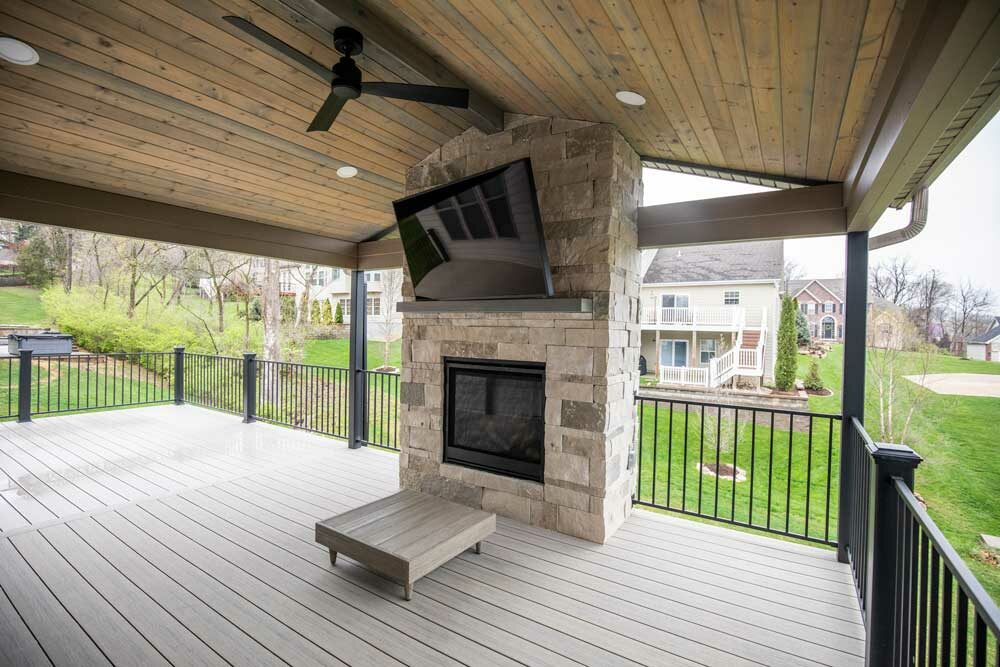 California Custom Decks custom deck with stone fireplace in Deckorators Voyage decking in Tundra color