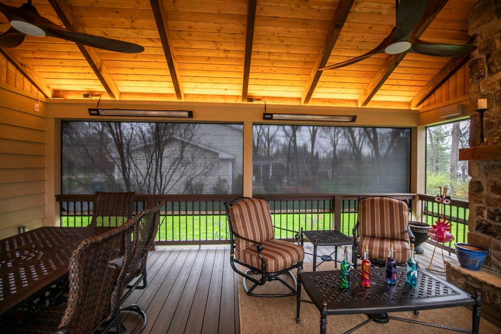 California Custom Decks retractable screen room with open deck and fireplace