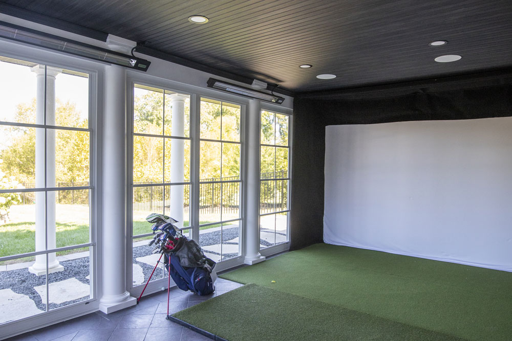 California Custom Decks white pergola and golf simulator three-season sunroom in Chesterfield Missouri
