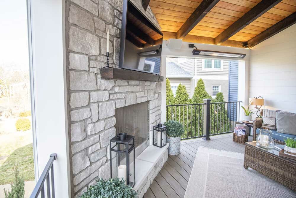 Outdoor fireplaces design - television over wood mantel