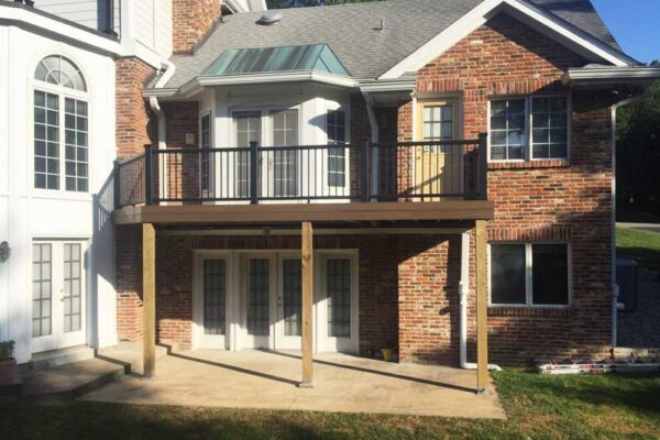 Open deck with black railings in Frontenac, MO