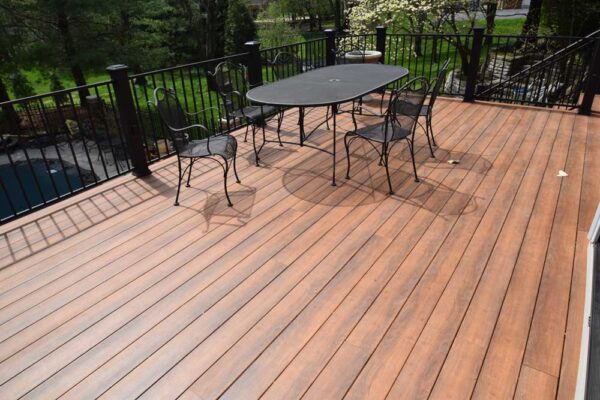 Open deck with black railings in Frontenac, MO