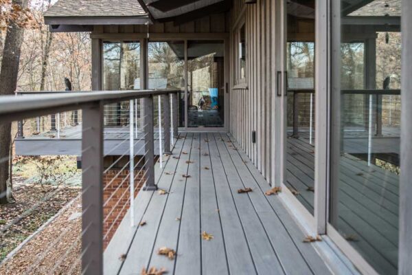 Custom composite wood deck with cable railing in Huntleigh, MO