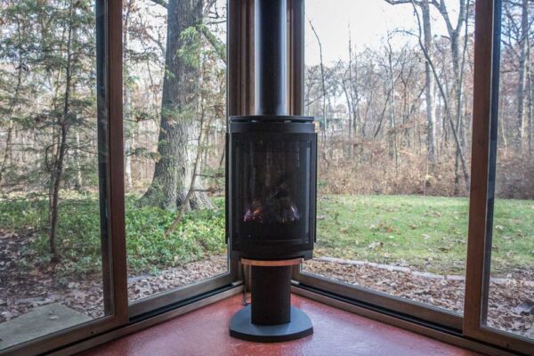 Interior of a Four Season Room with gas wood stove in Huntleigh, MO